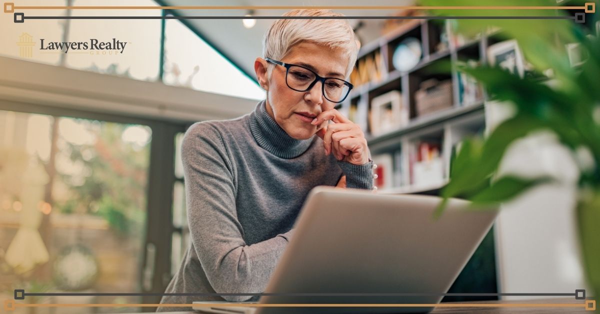 Mature woman looking at a laptop screen