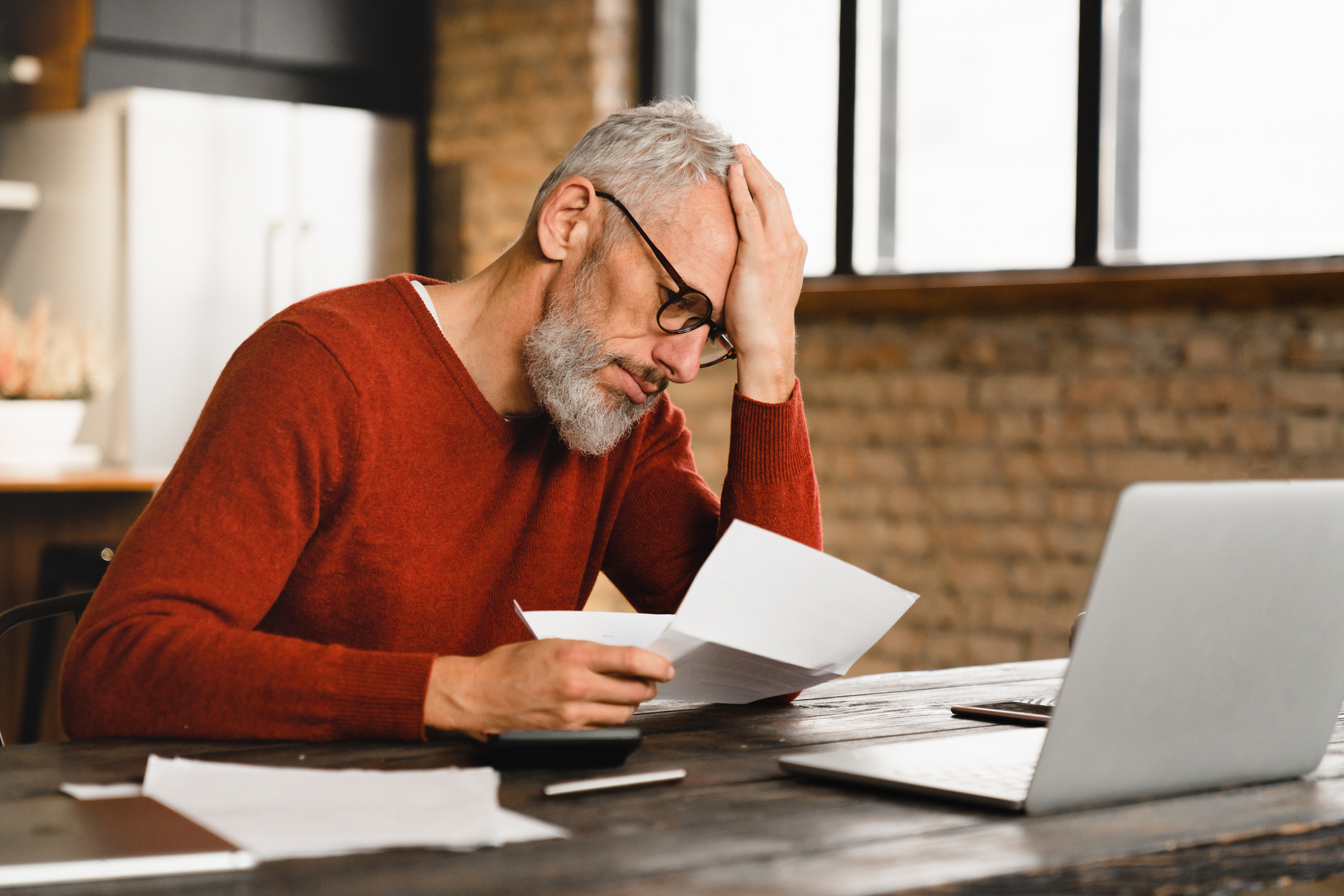 Man looking at foreclosure documents
